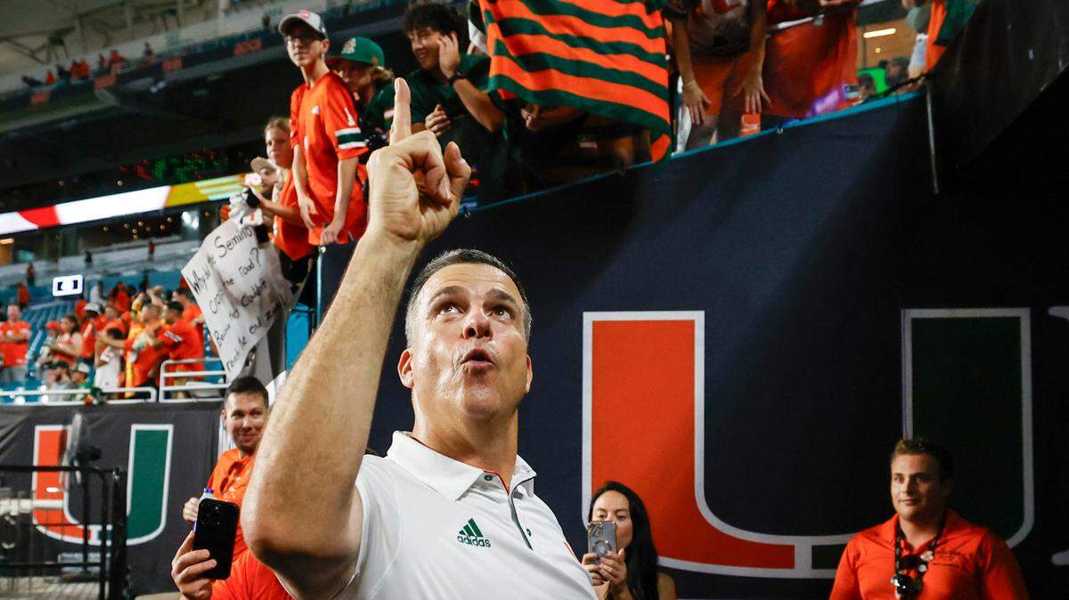 Miami Hurricanes head coach Mario Cristobal flashes the U after the Canes defeat the Florida State Seminoles during an NCAA football game at Hard Rock Stadium in Miami Garden, Florida on Saturday, October 26, 2024.