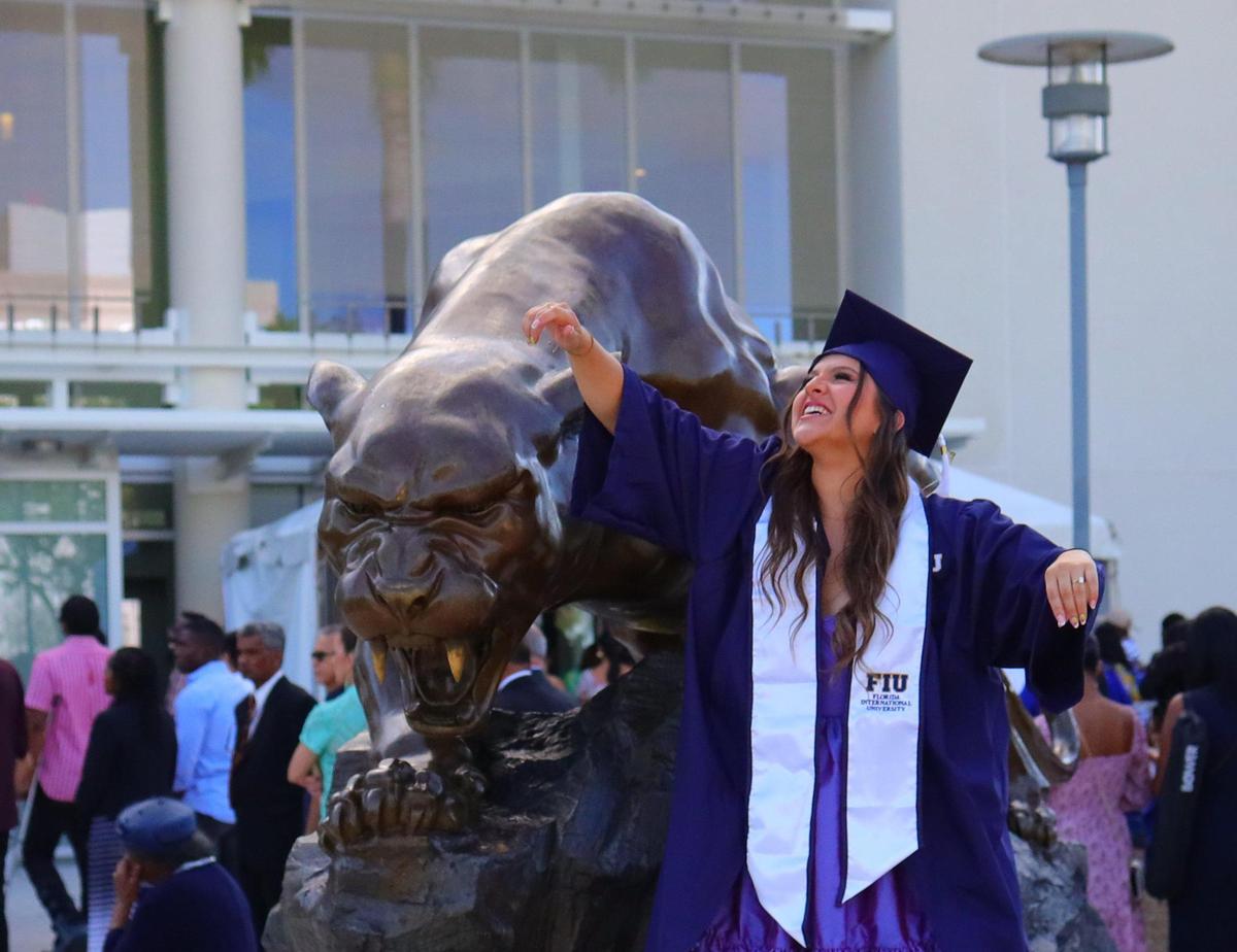 Flores, a Colombian native who lives in downtown Miami, celebrates her graduation. “I’m way too excited,” she said.
