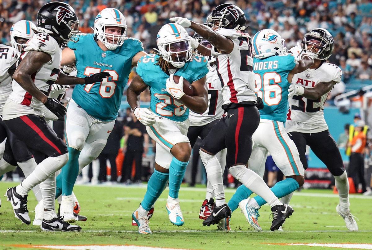 Miami Dolphins running back Jaylen Wright (25) scores against the Atlanta Falcons in the second quarter at Hard Rock Stadium, in Miami Gardens, Florida on Friday, August 9, 2024.