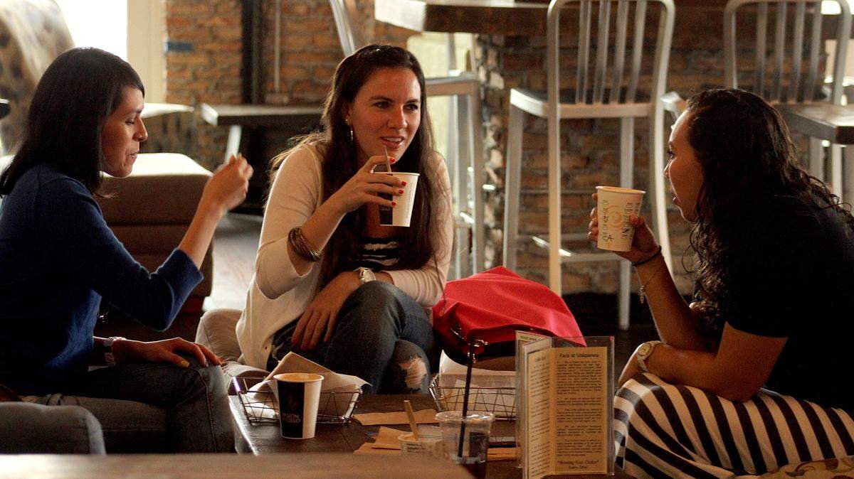 From left, friends Claudia Arias, Maria De La Vega, and Grecia Vazquez take a coffee break together at Pasion Del Cielo in Downtown Dadeland on March 29, 2013.