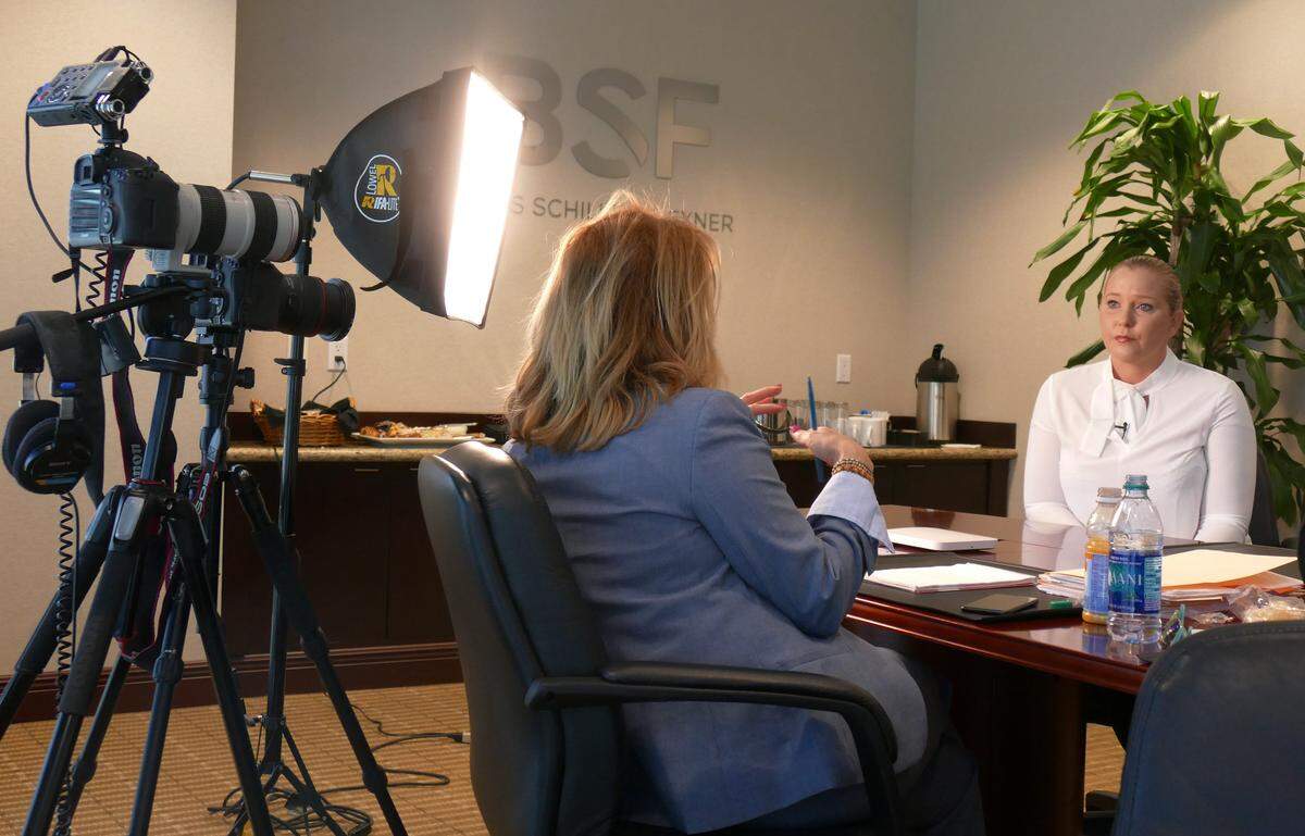 Miami Herald reporter, Julie Brown, interviews Virginia Roberts, a victim of Palm Beach sex offender Jeffery Epstein, in her attorney’s Ft. Lauderdale office on March 22, 2018.