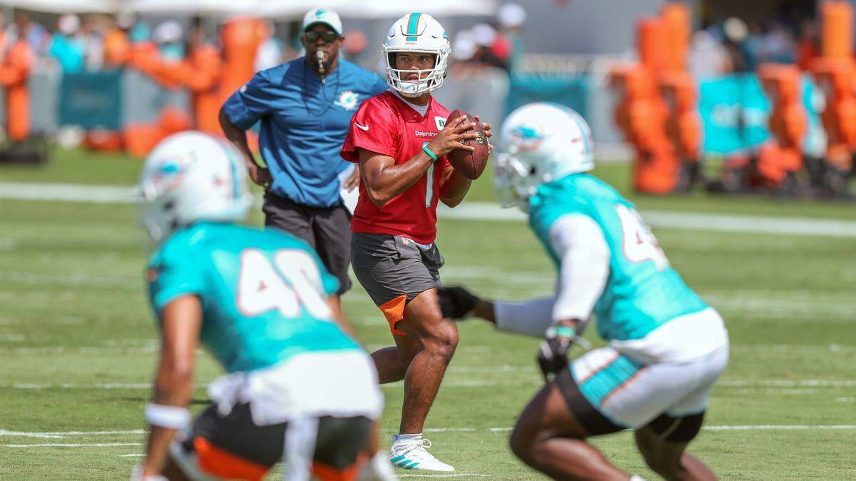 Miami Dolphins quarterback Tua Tagovailoa (1) sets up to pass during practice at Baptist Health Training Complex in Miami Gardens on Saturday, July 31, 2021.
