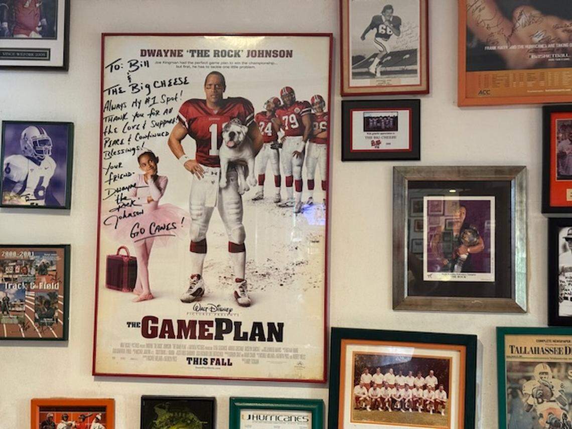 Dwayne “The Rock” Johnson signed the poster of his 2007 Walt Disney movie, “The Game Plan,” for his friends, Big Cheese owners Bill Archer and Garry Duell Jr. The framed poster hangs in a room at their restaurant.