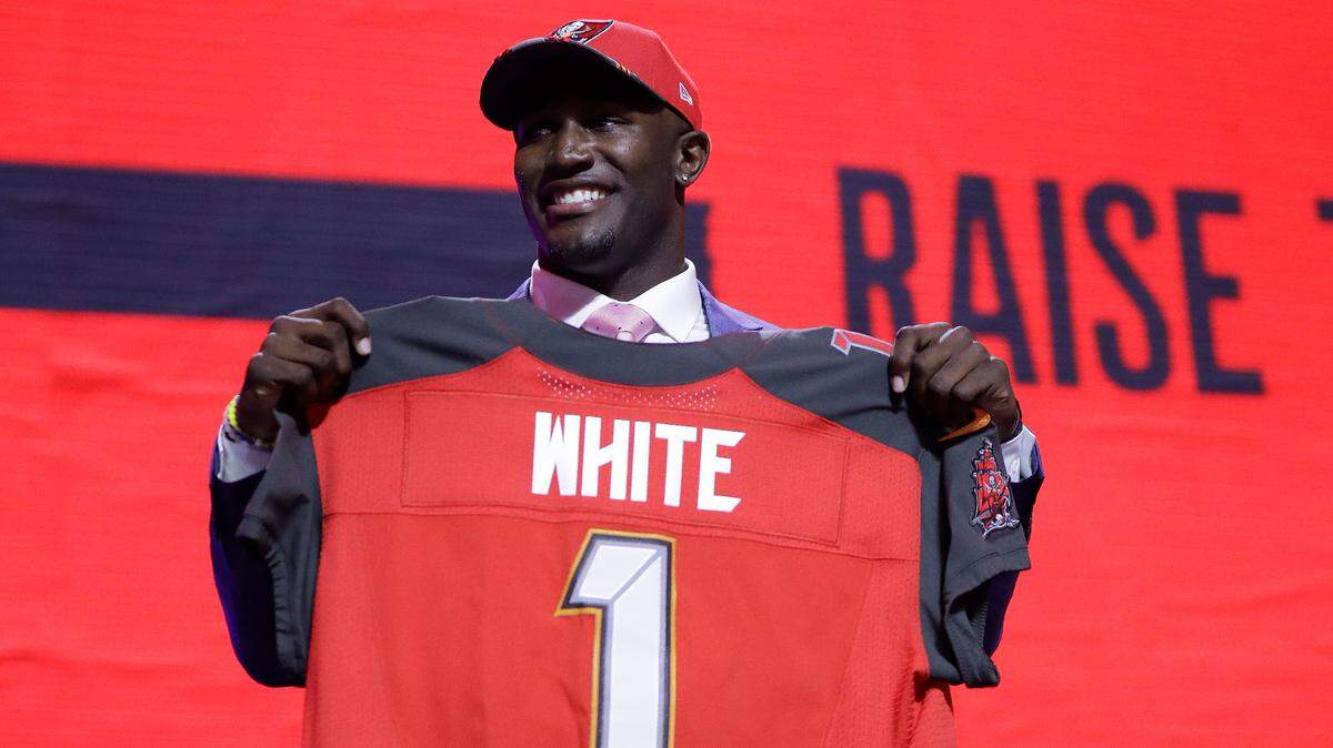 Louisiana State linebacker Devin White poses with his new jersey after the Tampa Bay Buccaneers selected White in the first round at the NFL football draft, Thursday, April 25, 2019, in Nashville, Tenn.