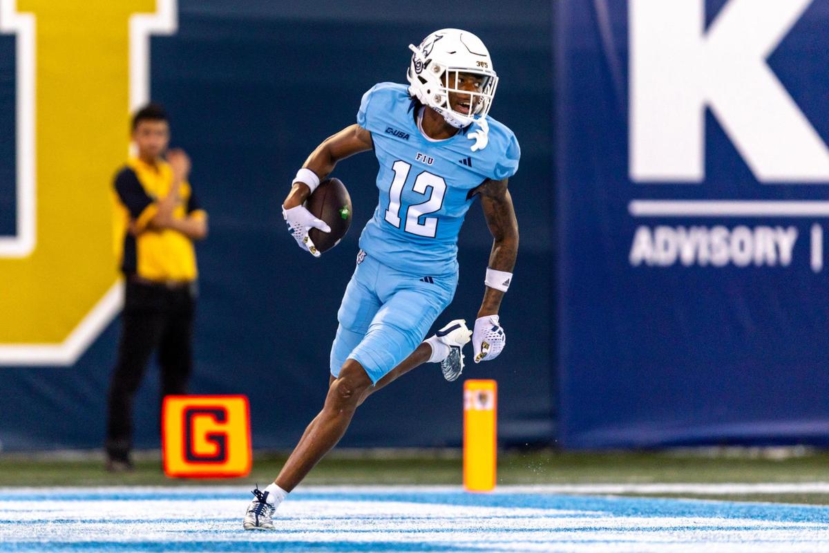 Florida International University defensive back Hezekiah Masses (12) scores a touchdown for a pick six during the first half of a college football game against North Texas at Riccardo Silva Stadium in Miami, Florida, on Saturday, September 9, 2023.