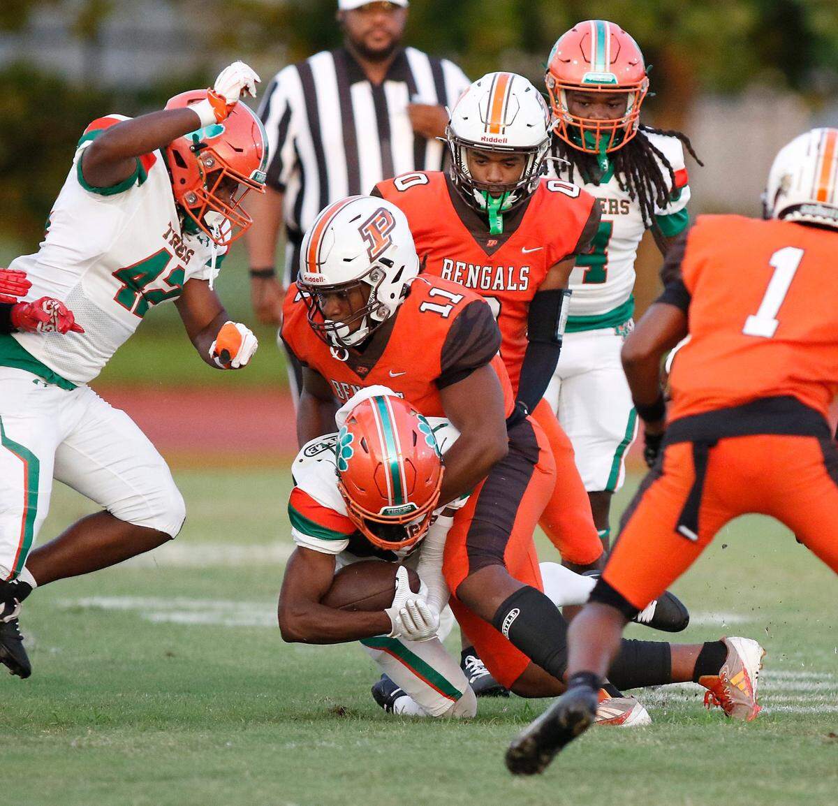 Blanche Ely Tigers Michael Warren is taken down by Piper Bengals linebacker Jaytoin Thomas (11) during football game on Friday, September 20, 2024 at Piper HS in Sunrise. Andrew Uloza / for Miami Herald