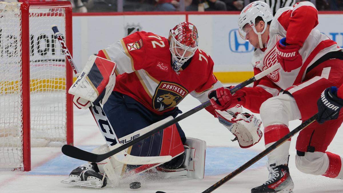 Jan 16, 2025; Sunrise, Florida, USA; Florida Panthers goaltender Sergei Bobrovsky (72) makes a save against Detroit Red Wings left wing Lucas Raymond (23) during the first period at Amerant Bank Arena.