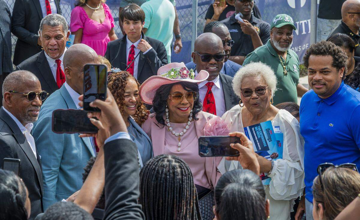 Elected officials joined U.S. Rep. Frederica Wilson (center) as she announced that she will not be seeking re-election in the midterm election, during a street naming event next to the Dr. Frederica S. Wilson/Skyway Elementary School in Miami Gardens, in recognition of her decades of service to South Florida, on Friday, May 29, 2026.