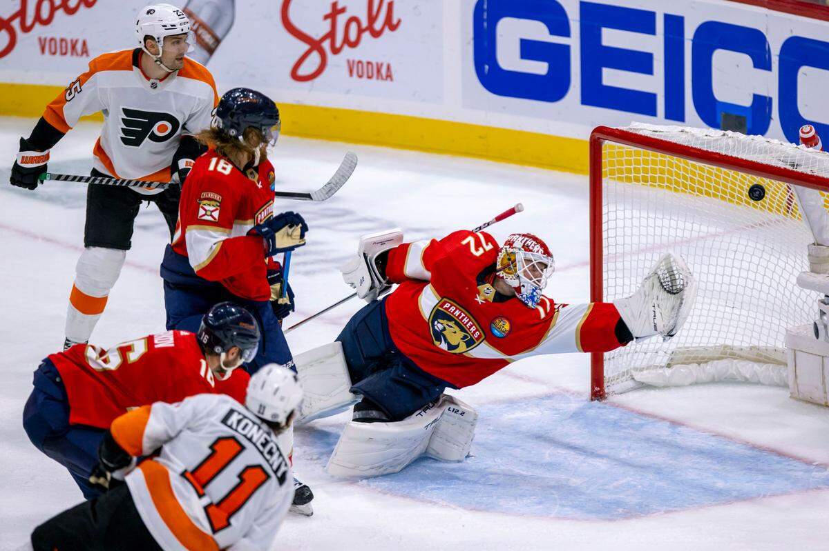 Florida Panthers goalie Sergei Bobrovsky (72) dives to save the shot by Philadelphia Flyers right wing Travis Konecny (11) during the third period of an NHL game at FLA Live Arena in Sunrise, Florida, on Wednesday, October 19, 2022.