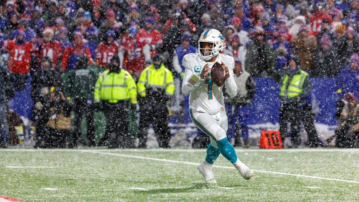 Miami Dolphins quarterback Tua Tagovailoa (1) sets up to pass during fourth quarter of an NFL football game against the Buffalo Bills at Highmark Stadium on Saturday, December 17, 2022 in Orchard Park, New York.