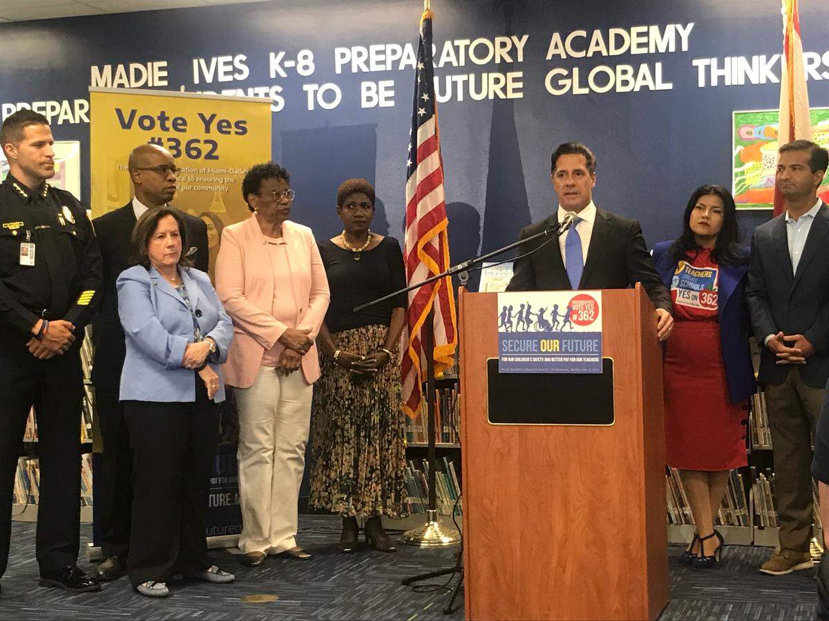 Aventura Mayor Enid Weisman, at left in a blue jacket, stands in support as Miami-Dade Schools Superintendent Alberto Carvalho speaks at an October 2018 press conference at Madie Ives K-8 in North Miami Beach for a property tax referendum benefiting teachers and schools police. Weisman previously worked as the school district’s human resources chief under Carvalho, and she hired him for his first teaching job at Miami Jackson High.