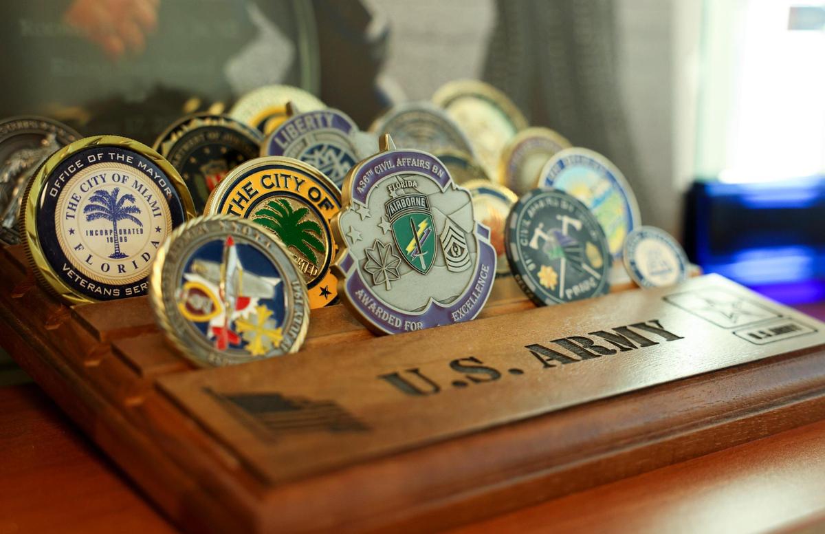 U.S. Army decorations of Rodney Jacobs, Assistant Director of the Miami Civilian Investigative Panel, sit in his office on Tuesday, Oct. 25, 2022, in Miami. The Civilian Investigative Panel works with the police force to find better ways to approach policing.