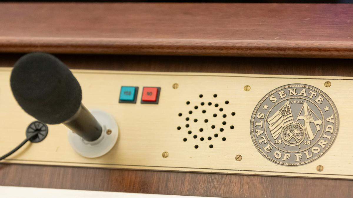 A view of a microphone that a state senator can use at their desk inside of the Florida Senate Chambers during the first day of the legislative session at the Florida State Capitol on Tuesday, March 4, 2025, in Tallahassee, Fla.