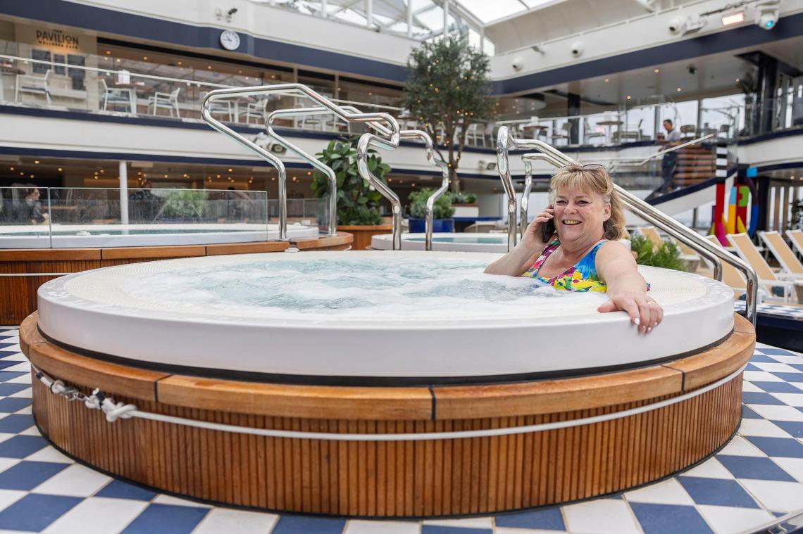Canadian tourist Rita Peters, 69, uses the jacuzzi at The Pavilion aboard Cunard’s Queen Anne while it is docked at PortMiami on Tuesday, Jan. 21, 2025, in Miami, Fla.