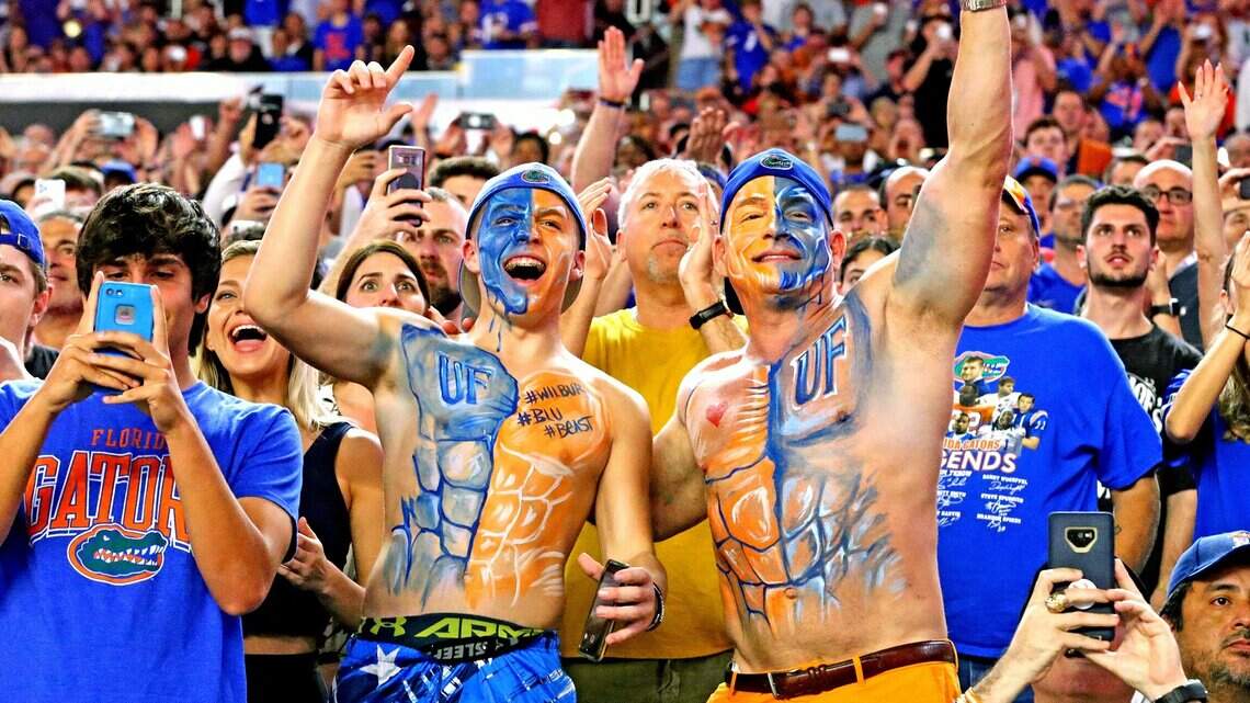 Florida Gators and Virginia Cavaliers fans blend together in this Orange Bowl matchup