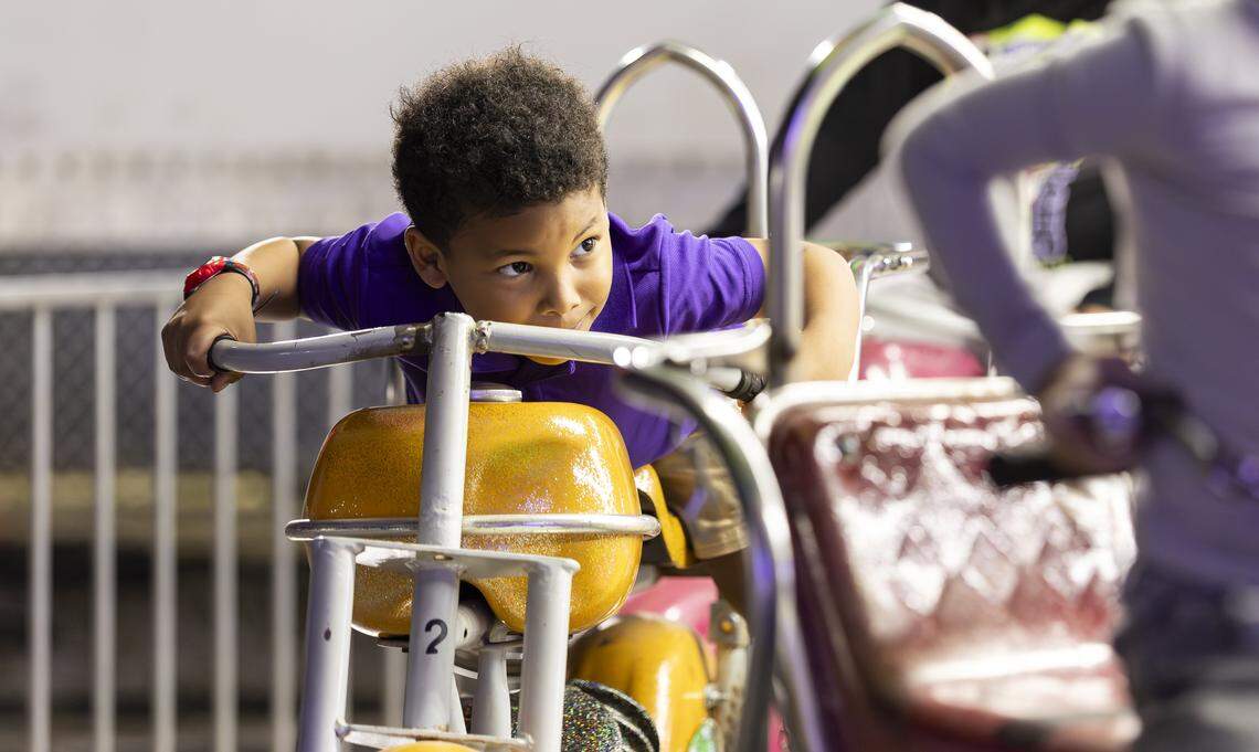 Dane Walker, 4, enjoys a ride during the grand opening of Ripley's Believe It or Not! Christmas Park at Amelia Earhart Park on Thursday, Nov. 13, 2025, in Hialeah, Fla.