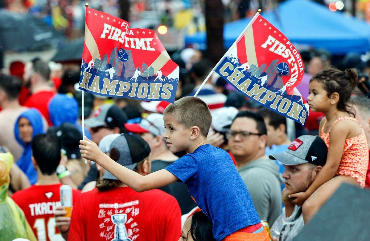 Panthers fans celebrate during the Florida Panthers Stanley Cup victory parade along A1A in Fort Lauderdale, Florida on Sunday, June 30, 2024. 