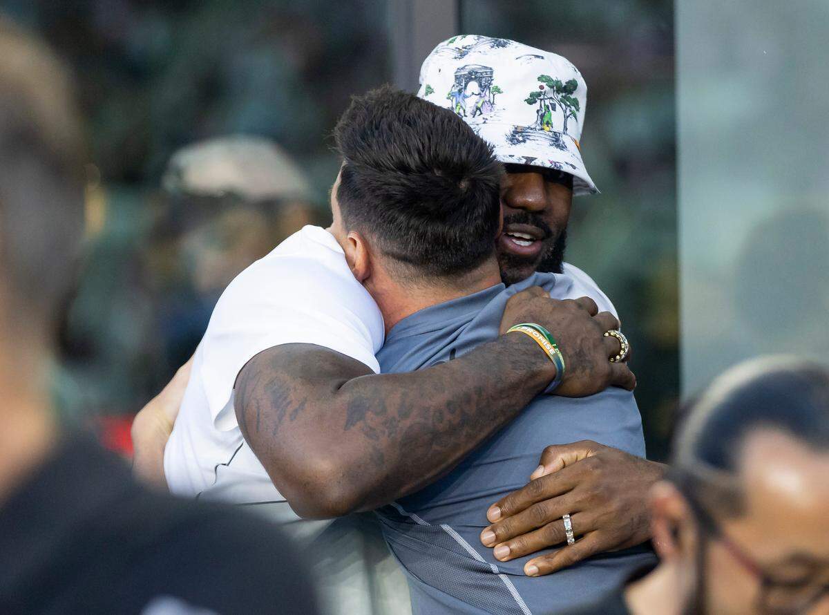 NBA player LeBron James hugs Inter Miami forward Lionel Messi (10) before the start of his Leagues Cup group stage match against Cruz Azul at DRV PNK Stadium on Friday, July 21, 2023, in Fort Lauderdale, Fla.