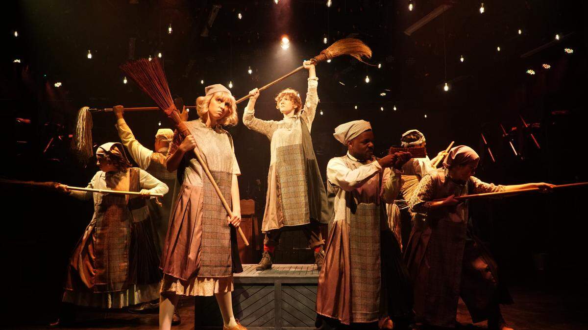 The cast of Area Stage’s ‘Annie’ performs ‘It’s the Hard Knock Life.’