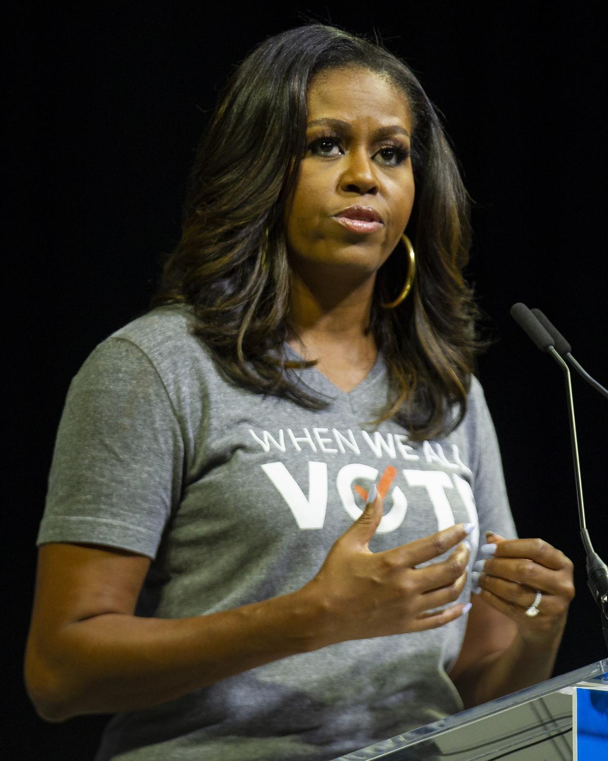 Michelle Obama speaks during the When We All Vote rally in the University of Miami’s Watsco Center on Friday, Sept. 28, 2018.