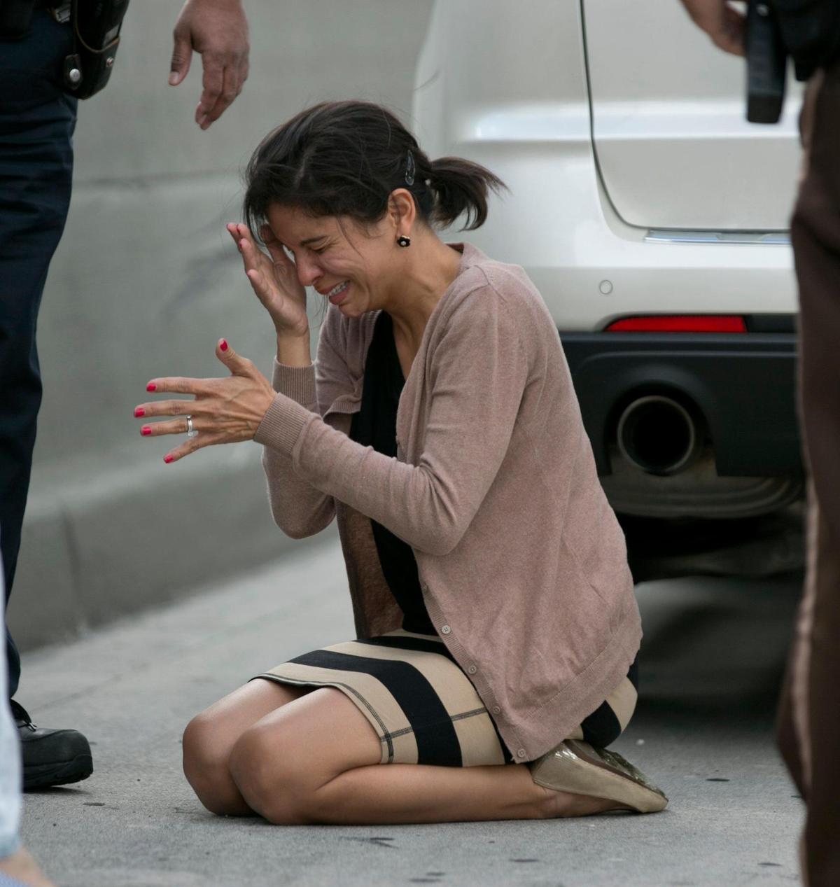 A distraught Pamela Rauseo after performing CPR on her nephew om State Roasd 836 on Feb. 20, 2014.