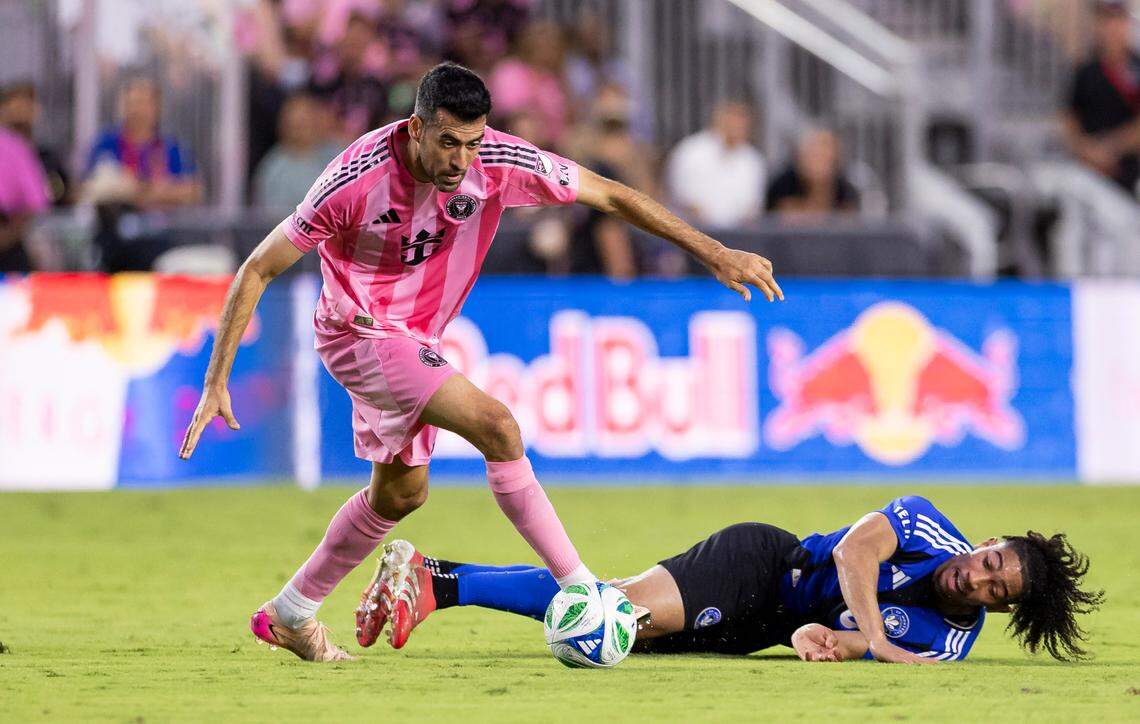 Inter Miami midfielder Sergio Busquets (5) competes for the ball against CF Montréal midfielder Nathan-Dylan Saliba (19) in the first half of their MLS match at Chase Stadium on Wednesday, May 28, 2025, in Fort Lauderdale, Fla.