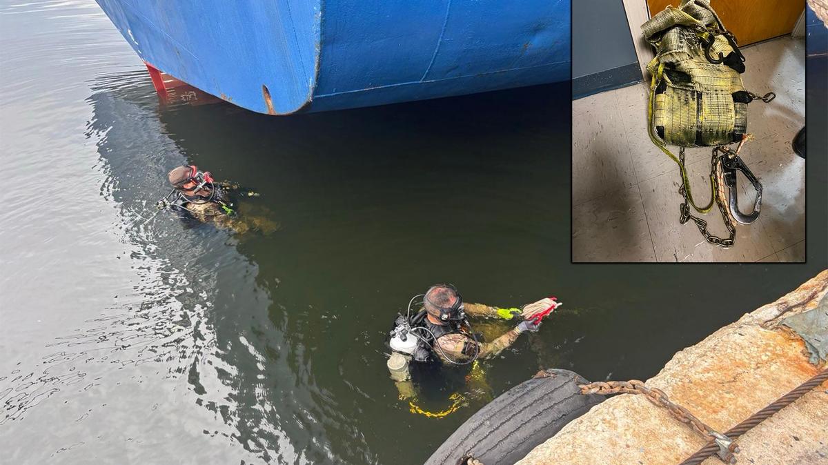 U.S. Border Patrol divers remove a package of cocaine attached to the bottom of a hull of a cargo ship at PortMiami Tuesday, Sept. 23. 2025.