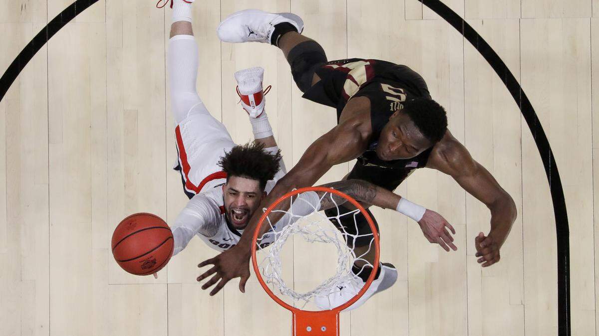 Gonzaga guard Josh Perkins, left, drives to the basket past Florida State forward Mfiondu Kabengele during the first half an NCAA men’s college basketball tournament West Region semifinal Thursday, March 28, 2019, in Anaheim, Calif.