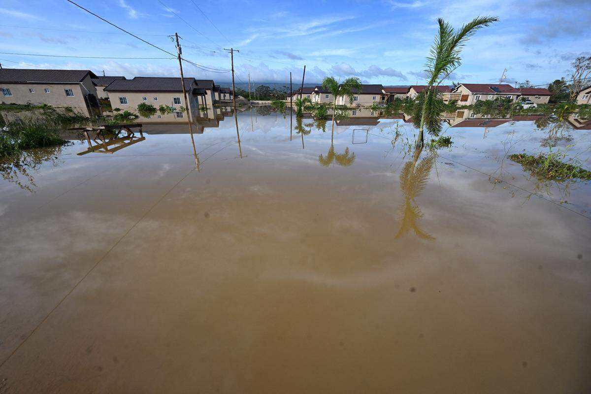 Flooded homes are seen after the passage of Hurricane Melissa in Howard Acres neighborhood in St. Elizabeth, Jamaica, on October 29, 2025. Hurricane Melissa ripped up trees and knocked out power after making landfall in Jamaica on October 28, 2025 as one of the most powerful hurricanes on record, inundating the island nation with rains that threaten flash floods and landslides. 