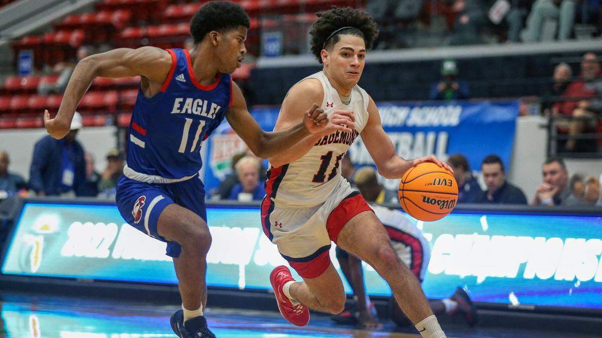 Sagemonts Adrian Cruz (11) drives the ball as North Florida Educational Tommie Hall (11) defends in the Class 2A boys basketball semifinal at the RP Funding Center in Lakeland on Wednesday, March 2, 2022.
