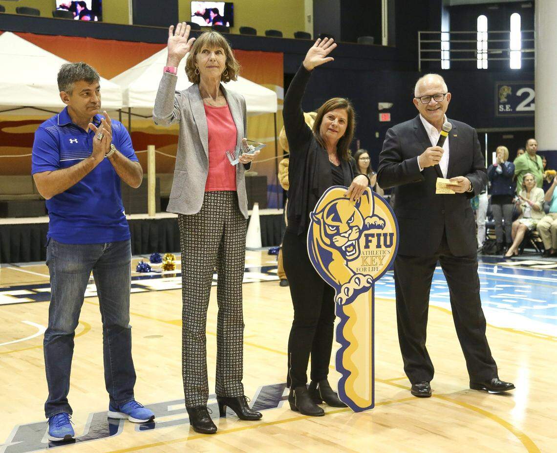Former Florida International University women’s basketball coach, Cindy Russo, right, and Inge Nissen wave toward the crowds during halftime at the FIU Arena on Saturday, Feb. 20, 2016. Russo and Nissen were honored for their contributions to the school by FIU President Mark Rosenberg.