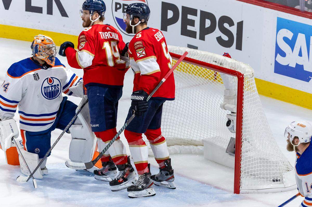 Florida Panthers left wing Matthew Tkachuk (19) celebrates with teammate Panthers defenseman Aaron Ekblad (5) after scoring a goal against Edmonton Oilers goaltender Stuart Skinner (74) during the second period of Game 5 of the NHL Stanley Cup Final at the Amerant Bank Arena on Tuesday, June 18, 2024, in Sunrise, Fla.