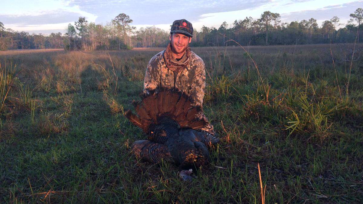 Austin Yarnell with his very first wild turkey, which he shot last season at Ron Bergeron’s Green Glades West ranch in Hendry County.