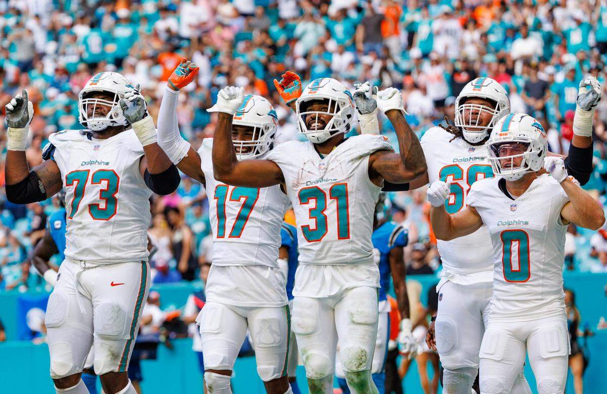 Miami Dolphins running back Raheem Mostert (31) celebrates with teammates after scoring a touchdown during third quarter of an NFL football game against the Carolina Panthers at Hard Rock Stadium on Sunday, Oct. 15, 2023 in Miami Gardens, Fl.