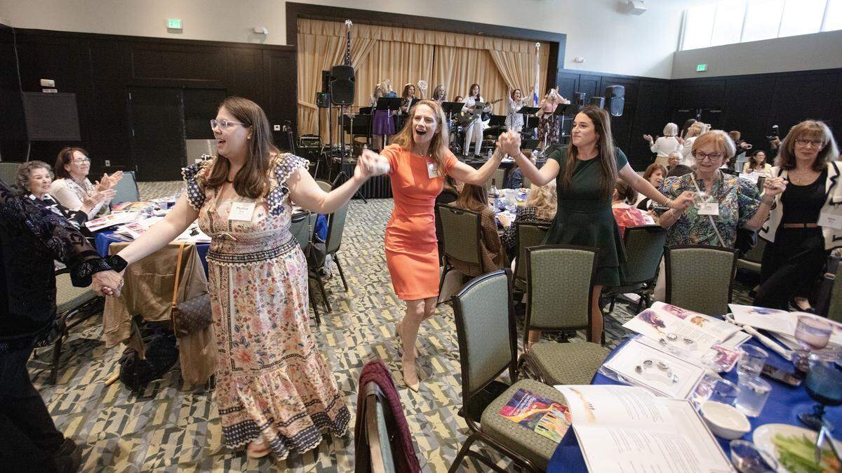 Participants in the Third Annual South Dade Community Women's Passover Seder dance led by Rabbi Rachel Greengrass of Temple Beth Am (in the center) on Sunday, March 30, 2026 at Temple Judea in Coral Gables. Andrew Uloza / for Miami Herald