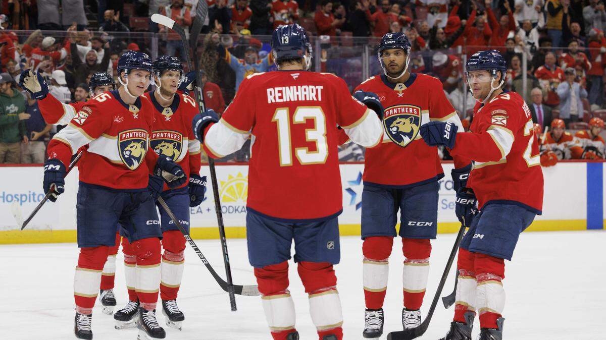 Florida Panthers center Sam Reinhart (13) skates to his teammates to celebrate his goal during the third period of a game on Tuesday, Oct. 28, 2025, at Amerant Bank Arena in Sunrise, Fla. The Anaheim Ducks won 3-2 in a shootout. 