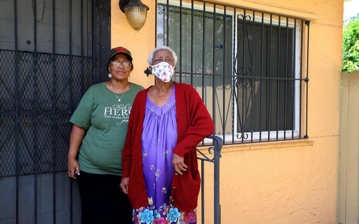 Sharon Frazier-Stephens and her mother Louella Wallace outside their two-bedroom duplex in Little Haiti, which has been upgraded with a new roof and impact windows, on Saturday, September 19, 2020.