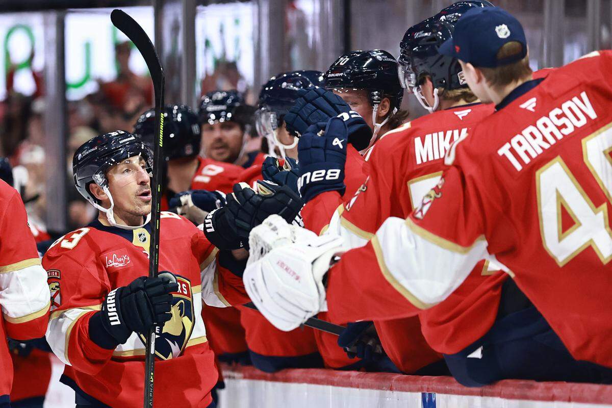 SUNRISE, FLORIDA - OCTOBER 11: Brad Marchand #63 of the Florida Panthers high fives teammates after scoring against the Ottawa Senators during the first period at Amerant Bank Arena on October 11, 2025 in Sunrise, Florida. (Photo by Carmen Mandato/Getty Images)