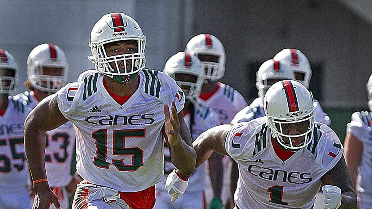 Defensive linemen #15 Gregory Rousseau and #1 Nesta Jade Silvera run drills during the second day of University of Miami fall football camp  at Greentree Field in Coral Gables on Sunday, August 5, 2018.