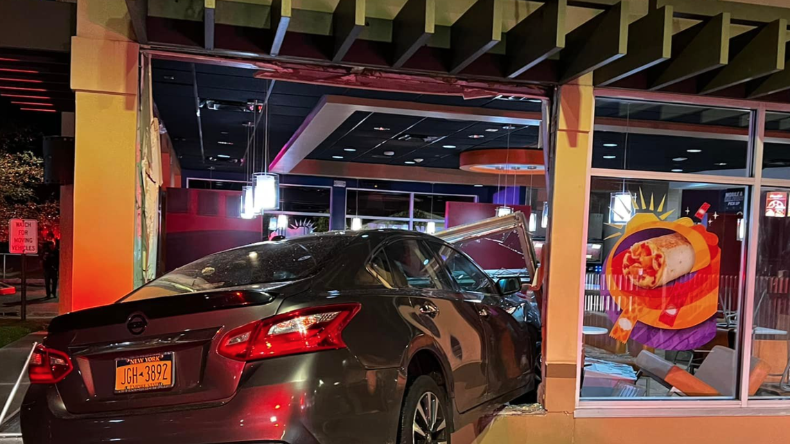 A car crashed through the window of a Taco Bell around 3:30 a.m. in Long Island, New York, and caused major damage, photos from the Islip Fire Department show. 