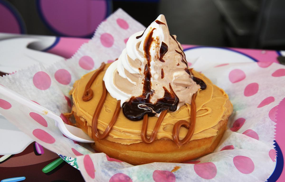 The Donut Sundae from Fluffyâ€™s at the Youth Fair. The sundae pictured features a dulce de leche donut topped with vanilla, chocolate swirl soft serve and hot fudge. The donut sundae costs $10 and can be found at location 354.