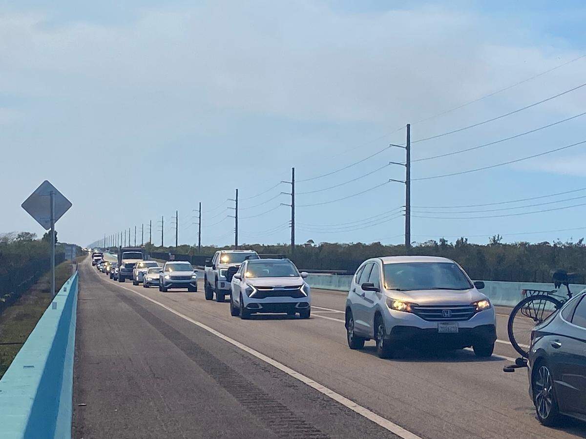 Traffic heading north on the 18 Mile Stretch slows to a crawl around Mile Marker 123 near Florida City, Friday, March 21, 2025. The highway has been closed intermittently since Tuesday due to massive brush fires in South Miami-Dade, spawned by dry weather and wind.