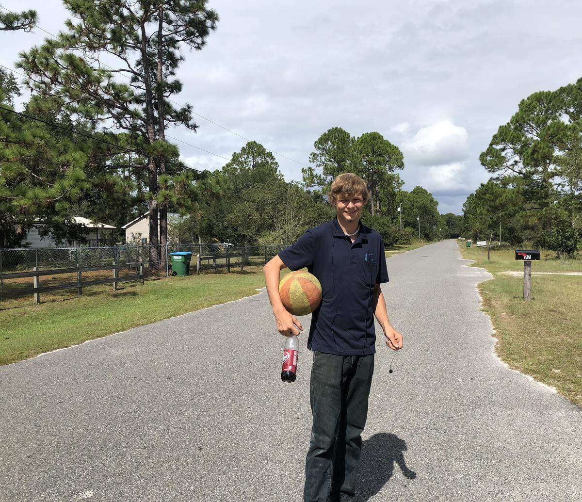 Matthew Hurley, a 19-year-old fisherman, bounced a basketball and listened to music while taking a break from boarding up windows and tying down boats.