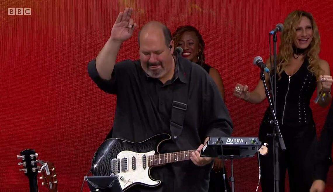 Plantation, Florida guitarist Dan Warner plays guitar for Barry Gibb at their last show together in Glastonbury in June 2017 in this BBC image. Background singer Beth Cohen (right) had known Warner for 31 years and collaborated often.