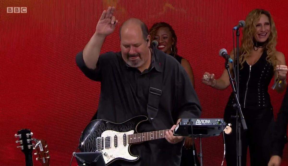 Plantation, Florida guitarist Dan Warner plays guitar for Barry Gibb at their last show together in Glastonbury in June 2017 in this BBC image. Background singer Beth Cohen (right) had known Warner for 31 years and collaborated often.