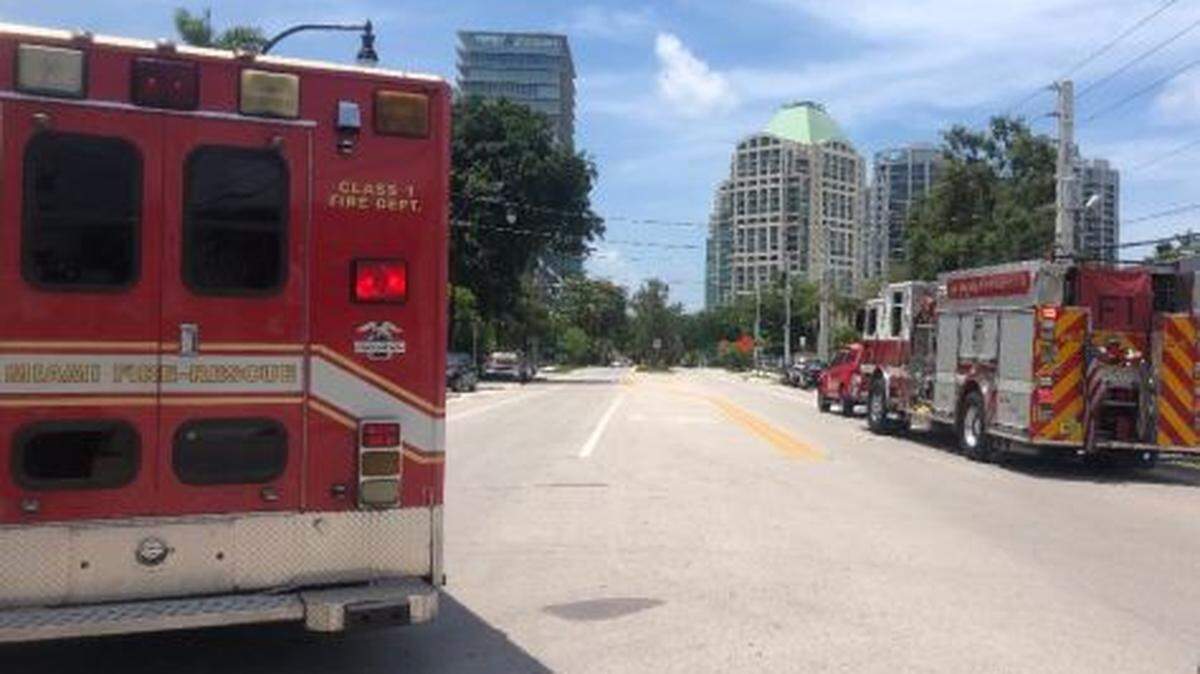 Miami Fire Rescue trucks and a closed Southwest 27th Avenue Wednesday.