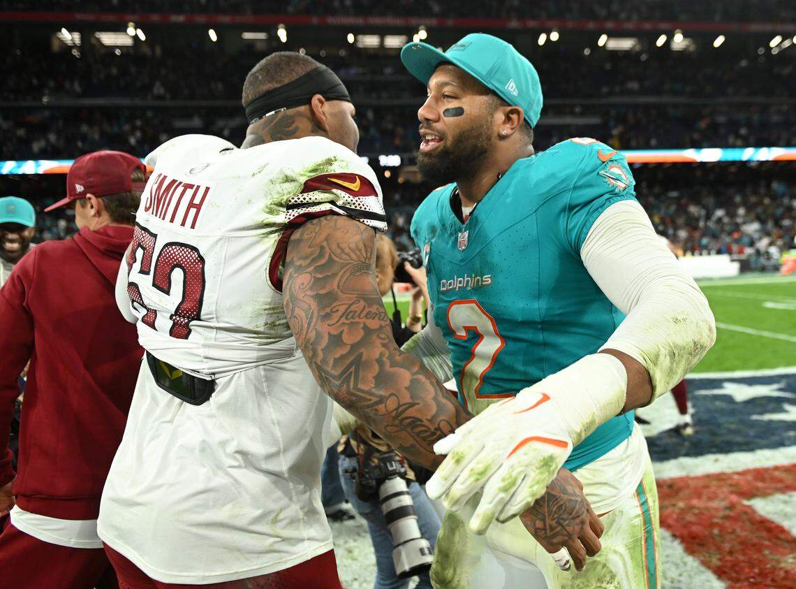 MADRID, SPAIN - NOVEMBER 16: Preston Smith of Washington Commanders (#52) and Bradley Chubb of Miami Dolphins (#2) hug after the NFL 2025 game between Washington Commanders and Miami Dolphins at Estadio Santiago Bernabeu on November 16, 2025 in Madrid, Spain. (Photo by Denis Doyle/Getty Images)