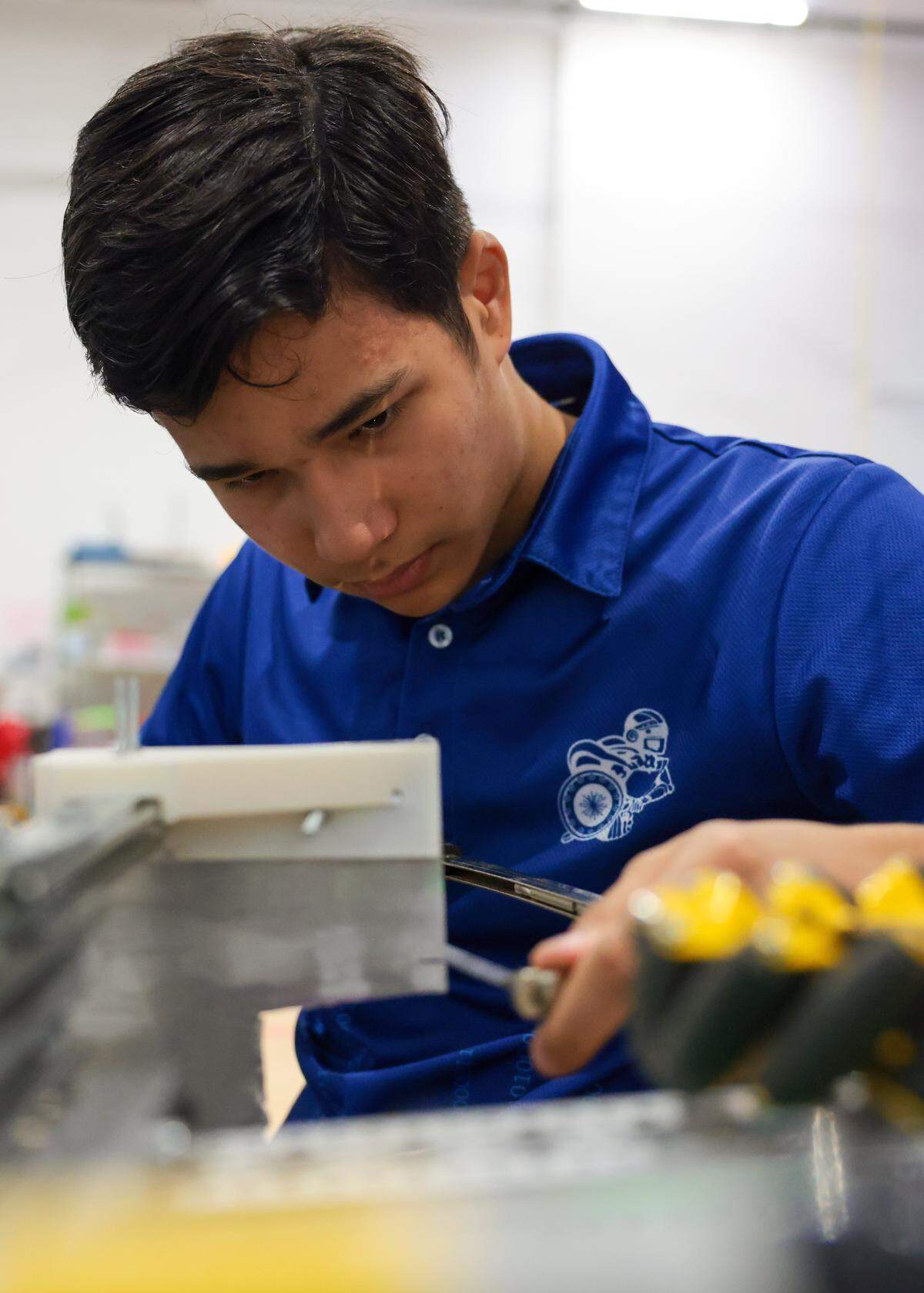 Reece Liu, a 10th grader and member of the Cyber Spartans robotics team, works on the robot the team will enter in the Florida state championship during a presentation at the Garner Center for Innovation at Miami Country Day School at 601 NE 107th St., on Monday, March 2, 2026, in Miami. Fla.