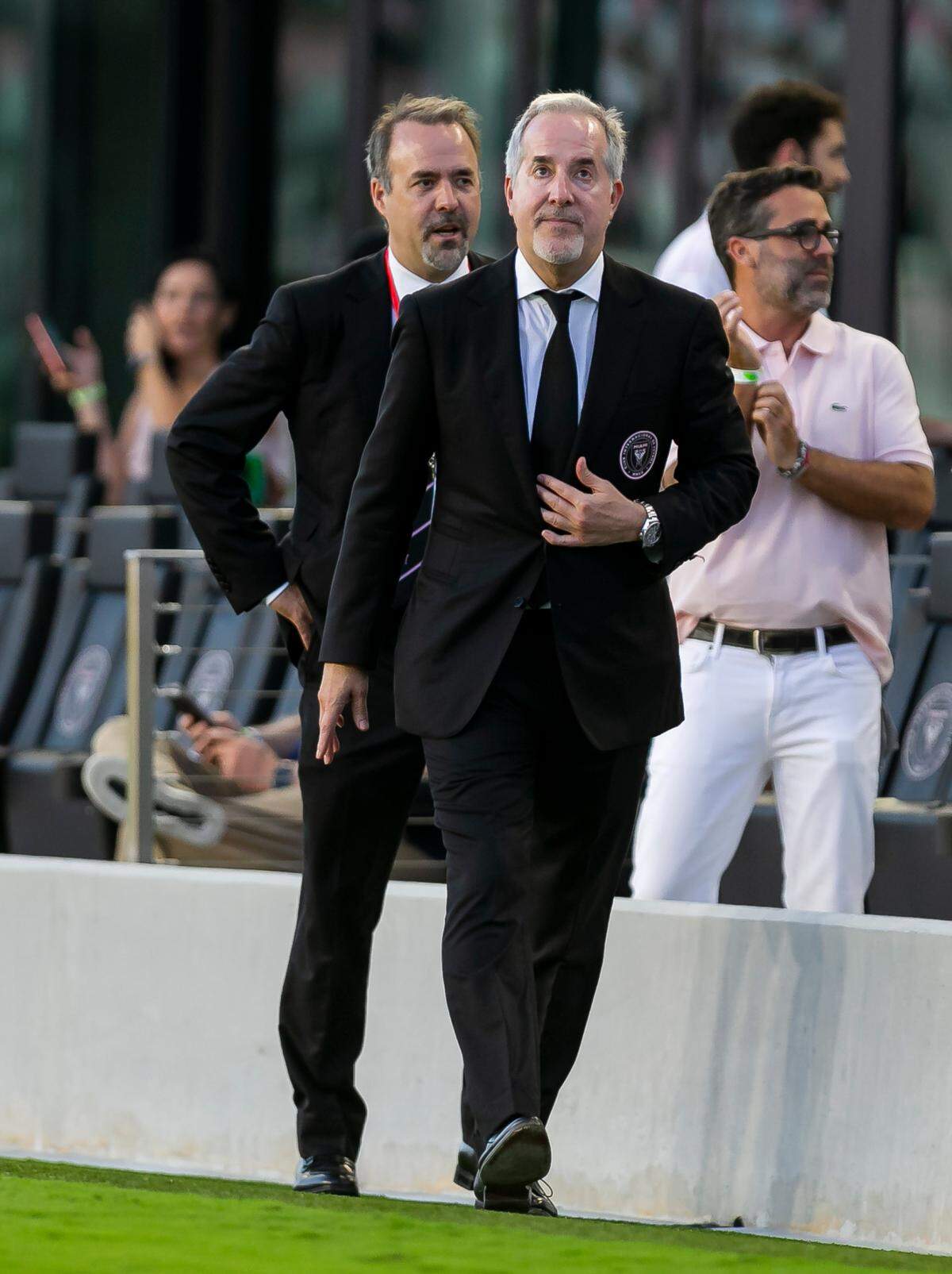 Inter Miami CF co-owners Jorge Mas, right, and his brother, Jose Ramon Mas, make their way to greet fans before their team’s MLS soccer match against D.C. United at the DRV PNK Stadium on Saturday, May 29, 2021. The club was fined $2 million for roster violations.