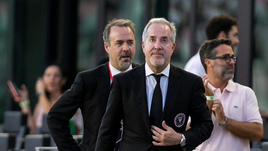 Inter Miami CF co-owners Jorge Mas, right, and his brother, Jose Ramon Mas, make their way to greet fans before their team’s MLS soccer match against D.C. United at the DRV PNK Stadium on Saturday, May 29, 2021. The club was fined $2 million for roster violations.